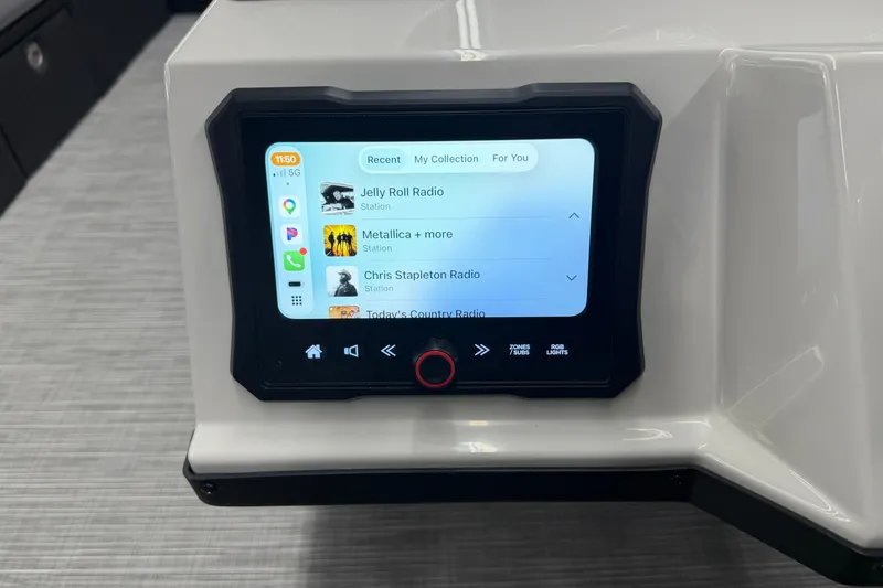 Slide: The Image of Touchscreen interface on 2027 Crest Conquest 230 SLSC displaying music stations. - 12