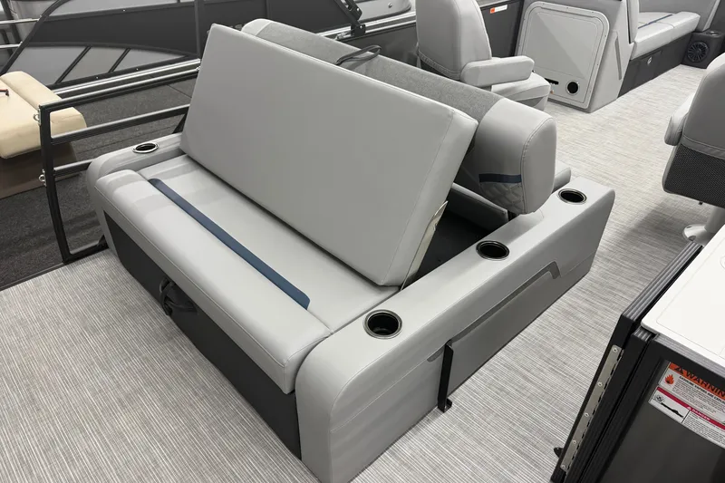 Slide: The Image of 2027 Crest Conquest 230 SLSC boat interior with gray seating and cup holders. - 18