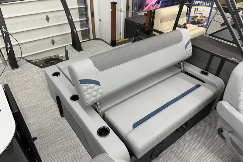 Slide: The Image of 2027 Crest Conquest 230 SLSC pontoon boat interior with gray seating and cup holders. - 15