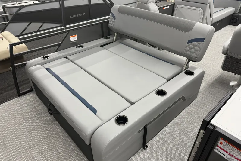 Slide: The Image of 2027 Crest Conquest 230 SLSC boat interior with gray seating and cup holders. - 17