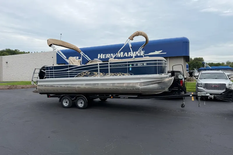 The Image of 2012 Bennington 2275 RLC pontoon boat on trailer at Hern Marine dealership. - 0