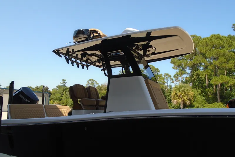 Slide: The Image of 2027 STRIKING BOATS 26XB with sleek design and modern features, set against a clear sky. - 3