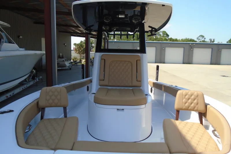 Slide: The Image of 2027 STRIKING BOATS 26XB interior with tan seating and modern design. - 7