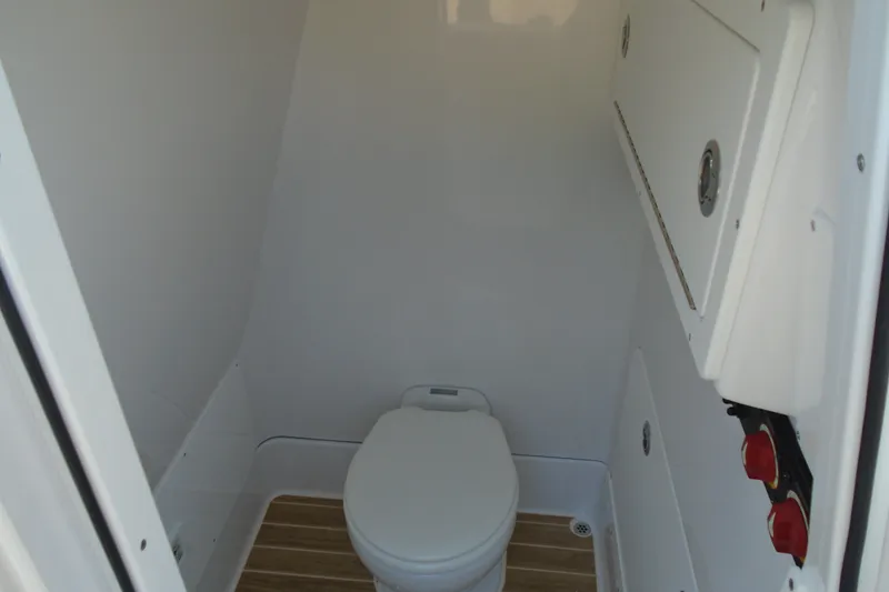 Slide: The Image of Compact marine toilet in 2027 STRIKING BOATS 26XB, featuring sleek white interior design. - 5