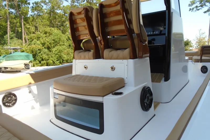 Slide: The Image of 2027 STRIKING BOATS 26XB interior with tan seating and modern console design. - 11