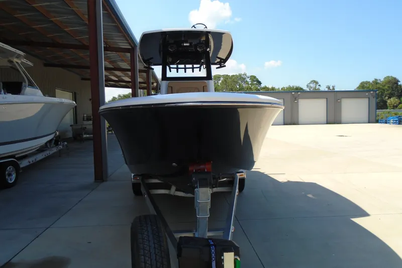 Slide: The Image of Front view of a 2027 STRIKING BOATS 26XB on a trailer in a boatyard. - 21