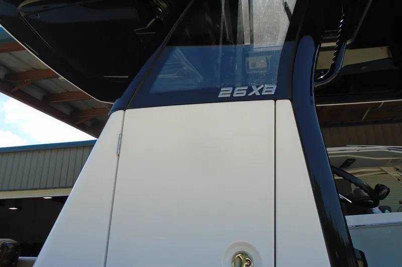 Slide: The Image of 2027 STRIKING BOATS 26XB model, close-up view under a covered structure. - 17