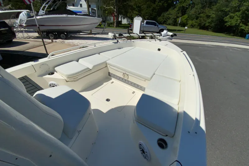 Slide: The Image of 2025 Pathfinder 2600 TRS boat interior with cushioned seating and storage compartments. - 33
