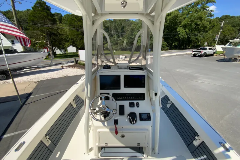 Slide: The Image of 2025 Pathfinder 2600 TRS boat cockpit with steering wheel and navigation controls. - 15