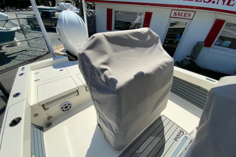 Slide: The Image of 2025 Pathfinder 2600 TRS boat with covered console, displayed at a sales lot. - 41