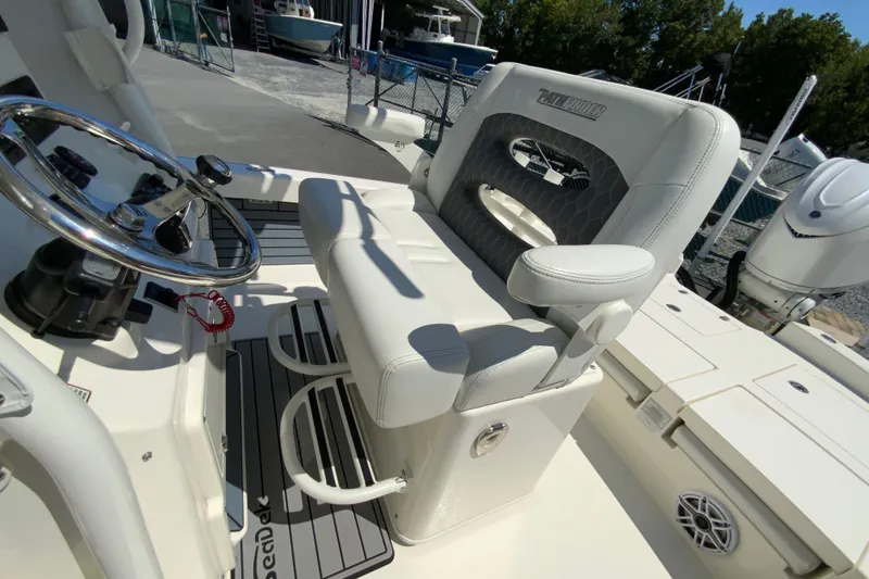 Slide: The Image of 2025 Pathfinder 2600 TRS boat interior with steering wheel and seating. - 19
