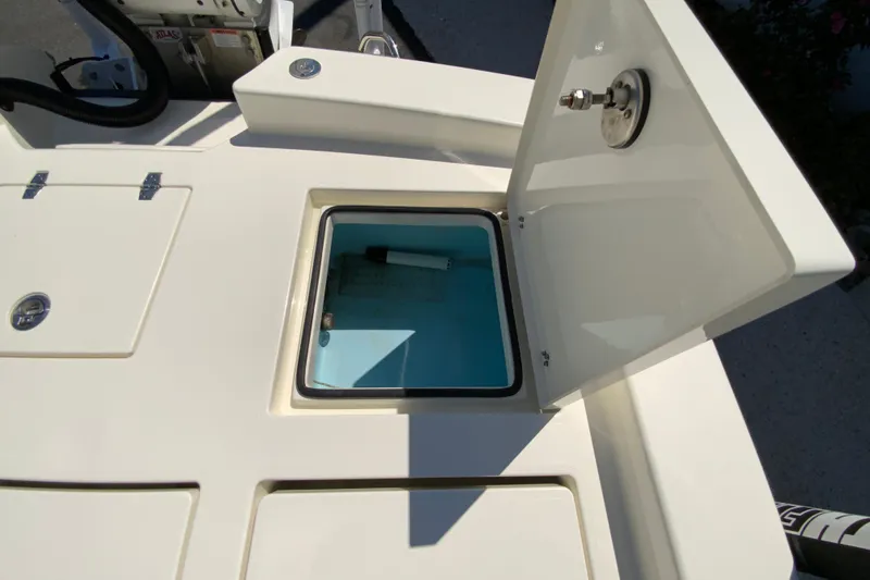 Slide: The Image of Open storage compartment on 2025 Pathfinder 2600 TRS boat, showcasing interior details. - 21