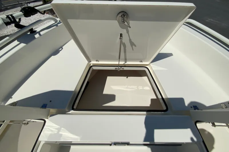 Slide: The Image of Open storage compartment on 2025 Pathfinder 2600 TRS boat, showcasing interior space. - 30