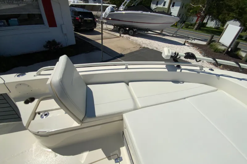 Slide: The Image of 2025 Pathfinder 2600 TRS boat interior with cushioned seating and sleek design. - 34