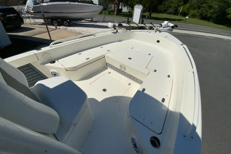 Slide: The Image of 2025 Pathfinder 2600 TRS boat interior with spacious seating and storage compartments. - 27