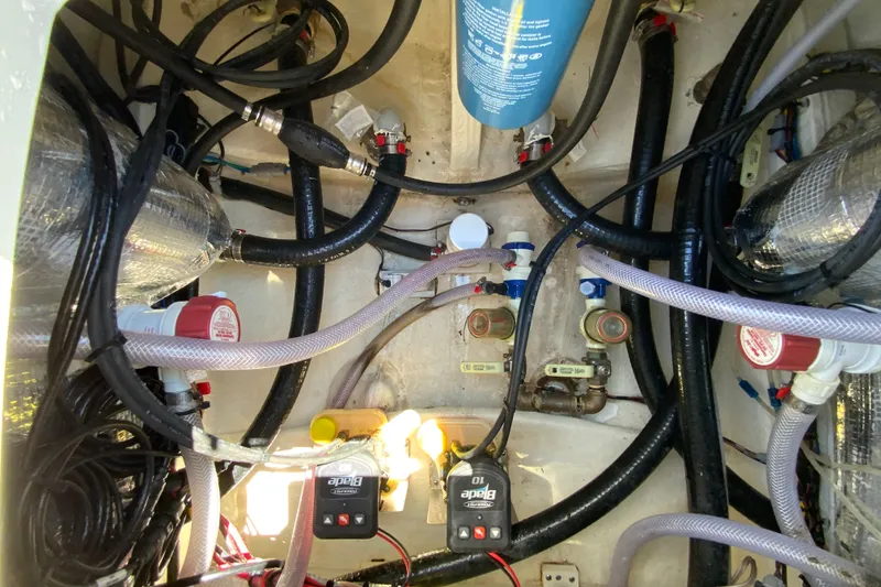 Slide: The Image of Engine compartment of 2025 Pathfinder 2600 TRS boat, showcasing hoses and components. - 25