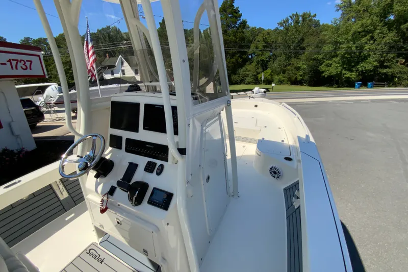 Slide: The Image of 2025 Pathfinder 2600 TRS boat cockpit with steering wheel and control panel. - 26