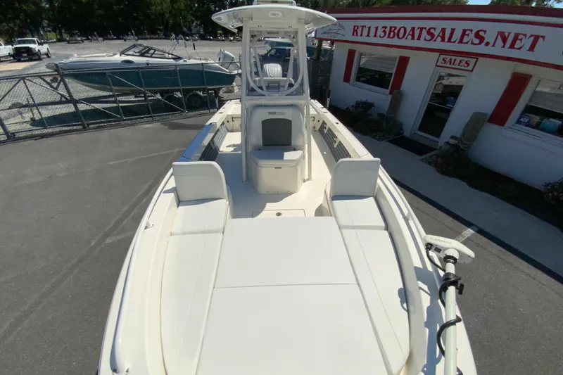 Slide: The Image of 2025 Pathfinder 2600 TRS boat displayed at dealership, featuring spacious seating and modern design. - 35
