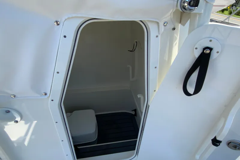 Slide: The Image of Interior view of 2025 Pathfinder 2600 TRS boat cabin with open door. - 37