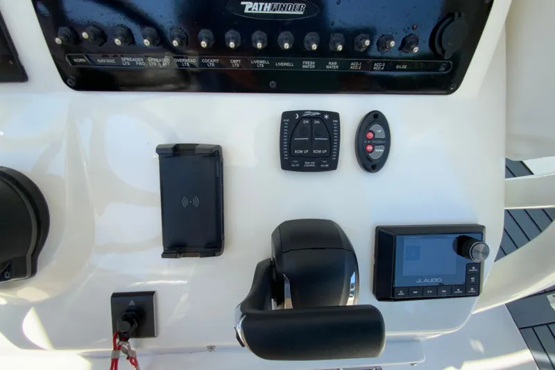 Slide: The Image of Control panel of 2025 Pathfinder 2600 TRS boat with switches and audio system. - 17