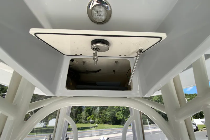 Slide: The Image of 2025 Pathfinder 2600 TRS boat storage compartment with open hatch and hydraulic support. - 44