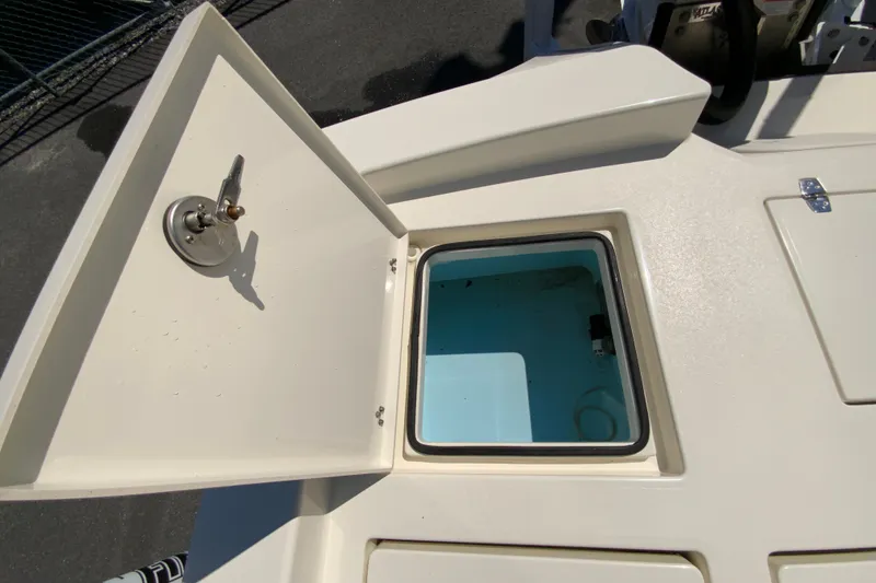 Slide: The Image of Open storage compartment on 2025 Pathfinder 2600 TRS boat, showcasing interior space. - 22