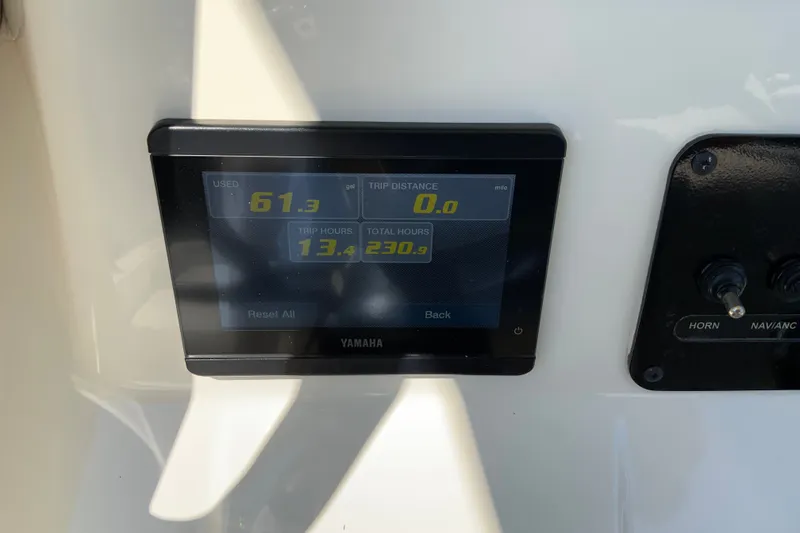 Slide: The Image of Yamaha display on 2025 Pathfinder 2600 TRS showing fuel usage and trip data. - 39