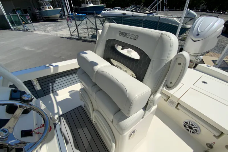 Slide: The Image of 2025 Pathfinder 2600 TRS boat interior with premium seating and steering wheel. - 18