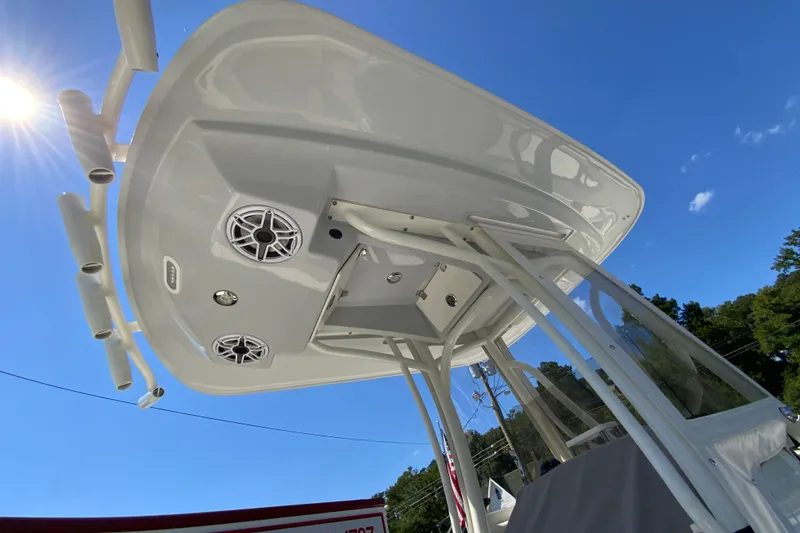 Slide: The Image of 2025 Pathfinder 2600 TRS boat with T-top and speakers under clear blue sky. - 43