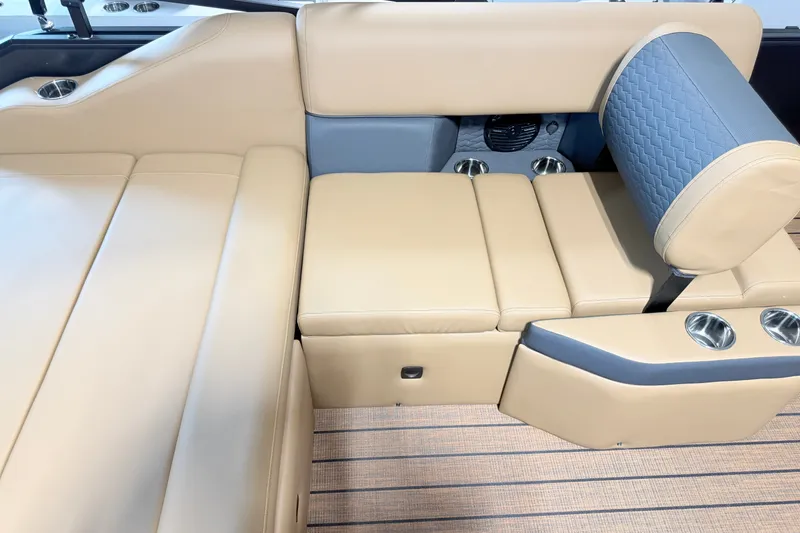 Slide: The Image of 2027 Bentley Pontoons Elite 223 Swingback Bench with luxurious beige seating and cup holders. - 15