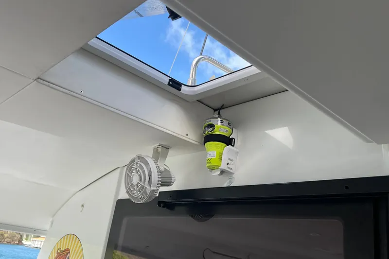 Slide: The Image of Interior view of 2021 Fountaine Pajot SABA 50 yacht with safety equipment and fan. - 98