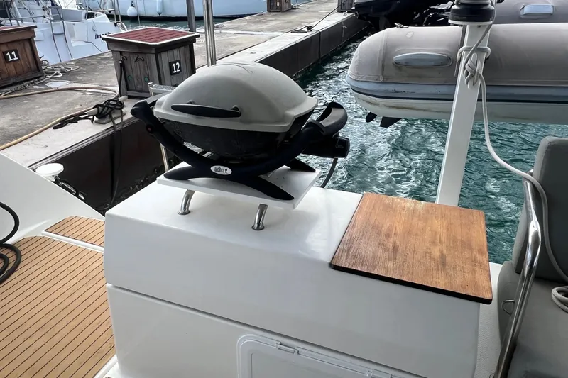 Slide: The Image of Outdoor grill on 2021 Fountaine Pajot SABA 50 yacht deck near marina. - 97