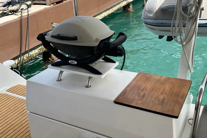 Slide: The Image of Outdoor grill setup on 2021 Fountaine Pajot SABA 50 yacht deck by the water. - 128