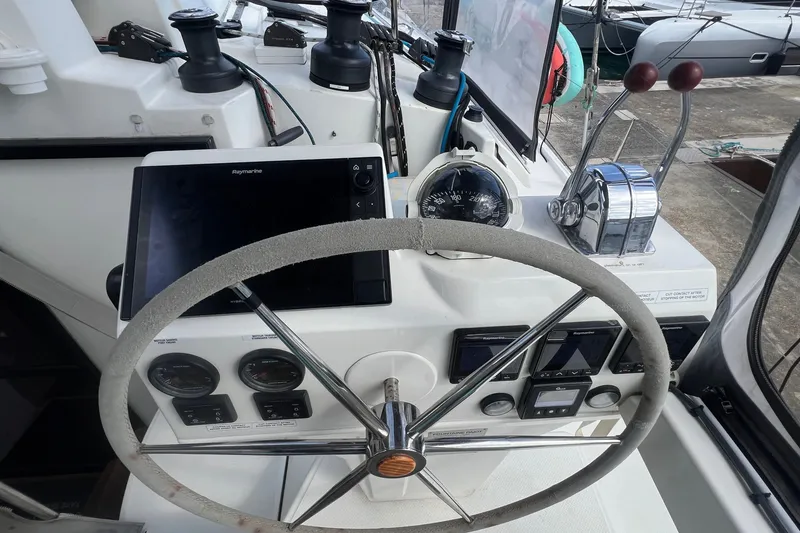Slide: The Image of Helm of 2021 Fountaine Pajot SABA 50 catamaran with navigation instruments and controls. - 42