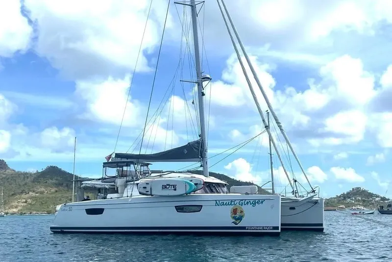 The Image of 2021 Fountaine Pajot SABA 50 catamaran sailing on a sunny day with scenic background. - 0