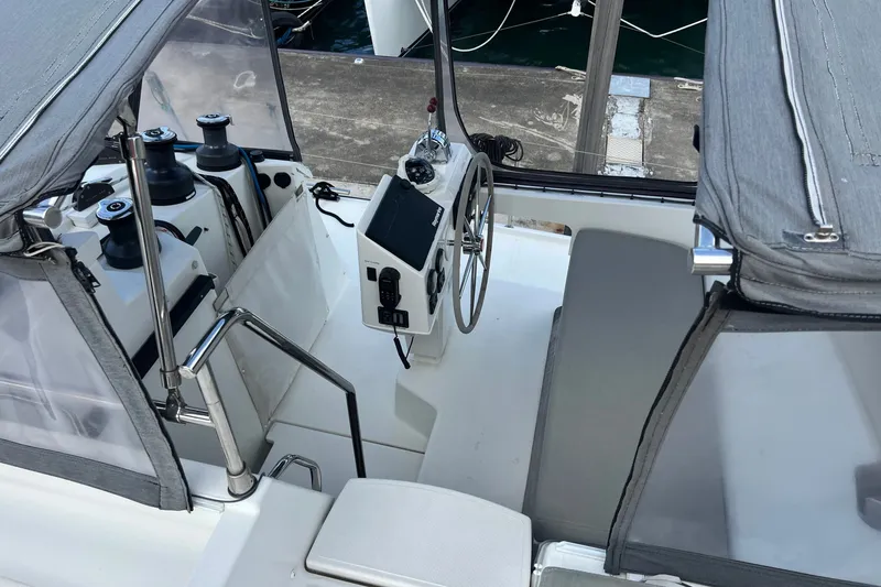 Slide: The Image of Helm station of 2021 Fountaine Pajot SABA 50 catamaran with steering wheel and navigation equipment. - 45