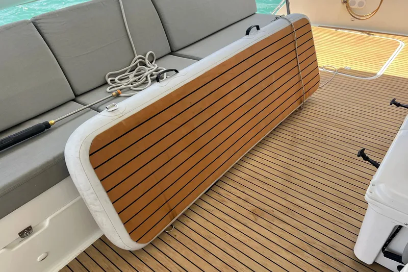 Slide: The Image of Deck of 2021 Fountaine Pajot SABA 50 catamaran with wooden flooring and seating. - 79