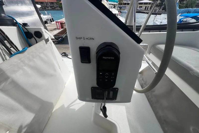 Slide: The Image of Control panel on a 2021 Fountaine Pajot SABA 50 yacht, featuring ship's horn and Raymarine device. - 32