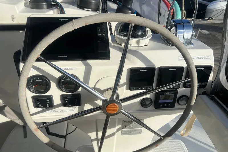 Slide: The Image of Steering wheel and controls of 2021 Fountaine Pajot SABA 50 catamaran. - 53