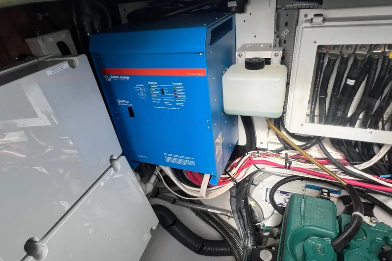 Slide: The Image of Electrical system inside a 2021 Fountaine Pajot SABA 50 yacht, featuring a Victron Energy inverter. - 62