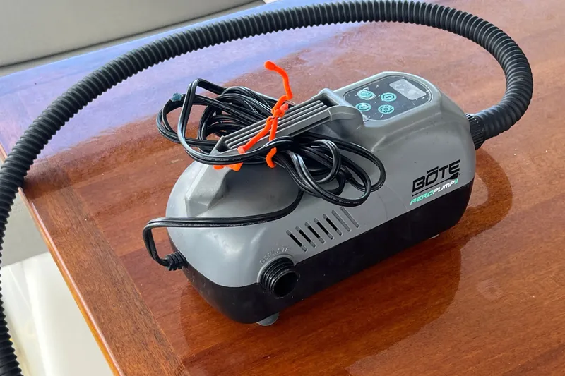 Slide: The Image of Electric air pump on a wooden surface, aboard a 2021 Fountaine Pajot SABA 50. - 94