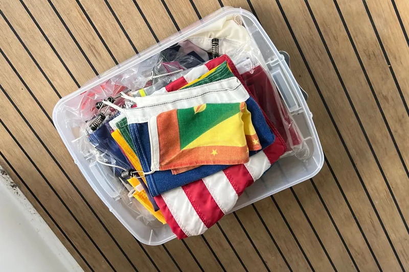 Slide: The Image of Box of colorful flags on Fountaine Pajot SABA 50 yacht deck, 2021 model. - 85