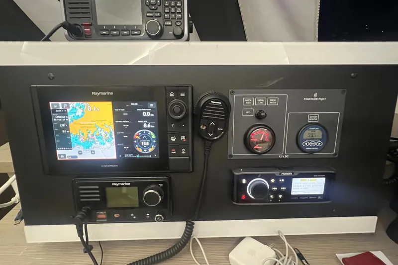 Slide: The Image of Control panel of a 2021 Fountaine Pajot SABA 50 catamaran with navigation and communication equipment. - 93