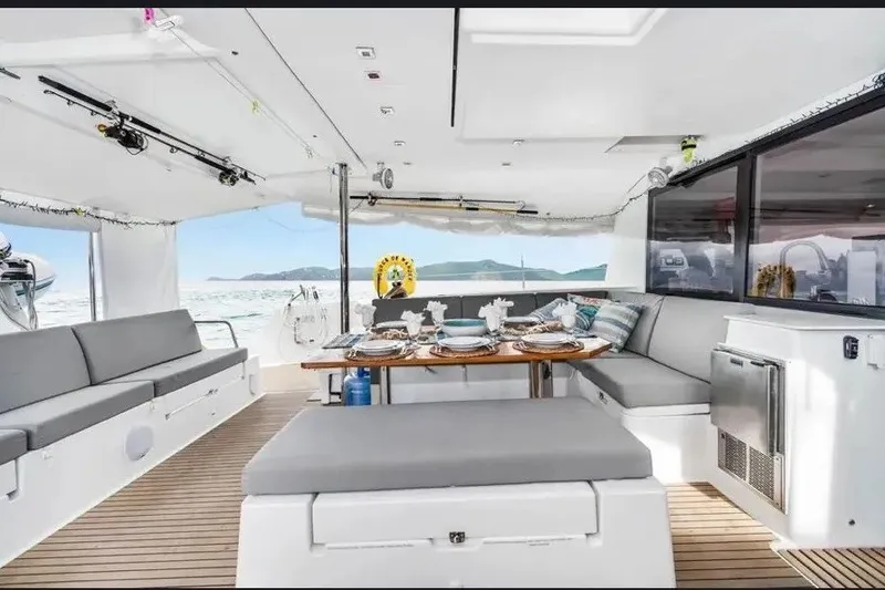 Slide: The Image of Luxurious 2021 Fountaine Pajot SABA 50 yacht interior with elegant dining setup. - 28