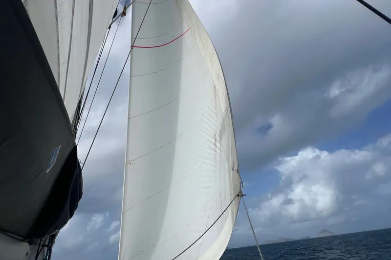 Slide: The Image of Sailing on a 2021 Fountaine Pajot SABA 50 catamaran under cloudy skies. - 119