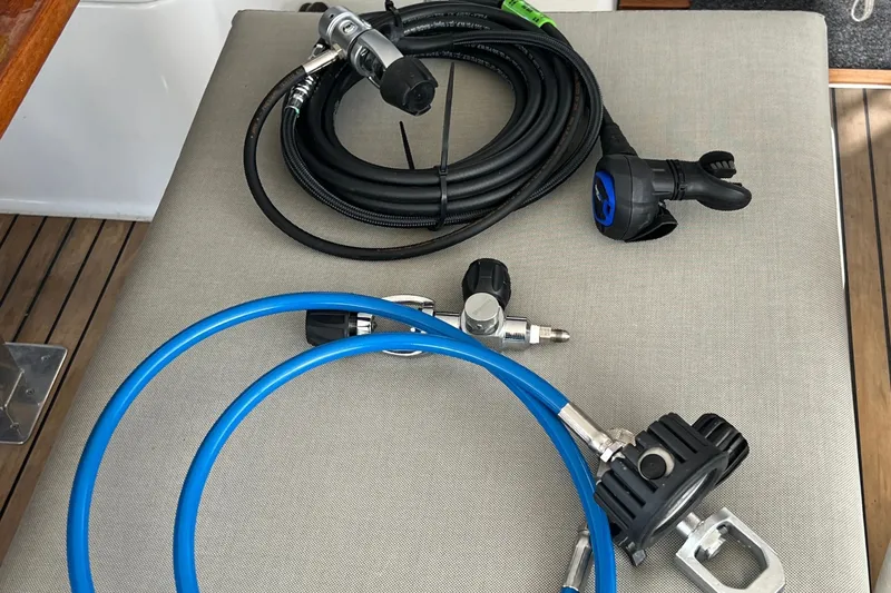 Slide: The Image of Diving equipment on Fountaine Pajot SABA 50 yacht, 2021 model, featuring hoses and regulators. - 77