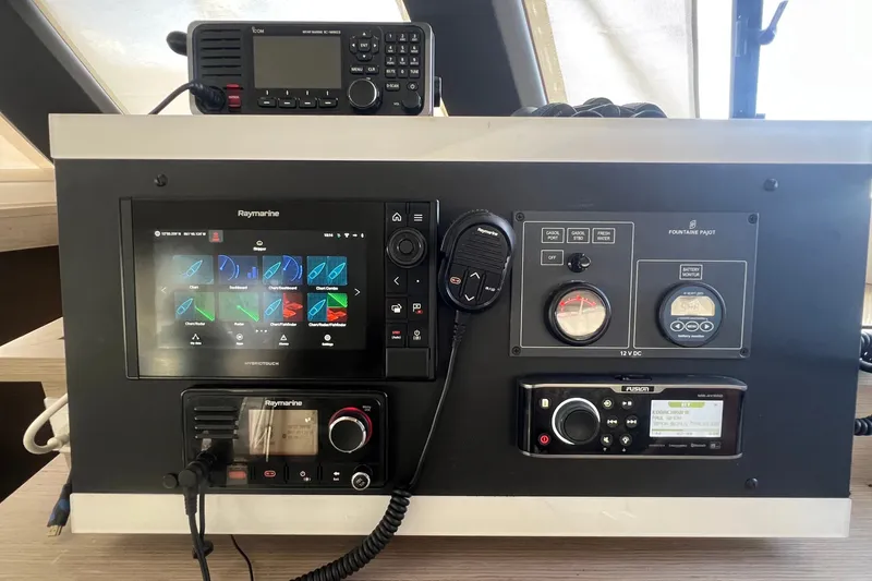 Slide: The Image of Control panel of a 2021 Fountaine Pajot SABA 50 catamaran with navigation and communication equipment. - 57