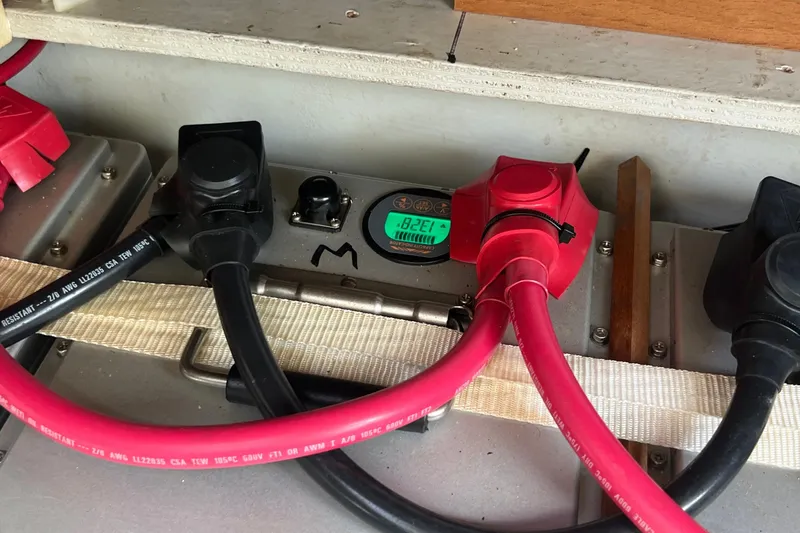 Slide: The Image of Battery compartment of 2021 Fountaine Pajot SABA 50 with cables and digital display. - 78