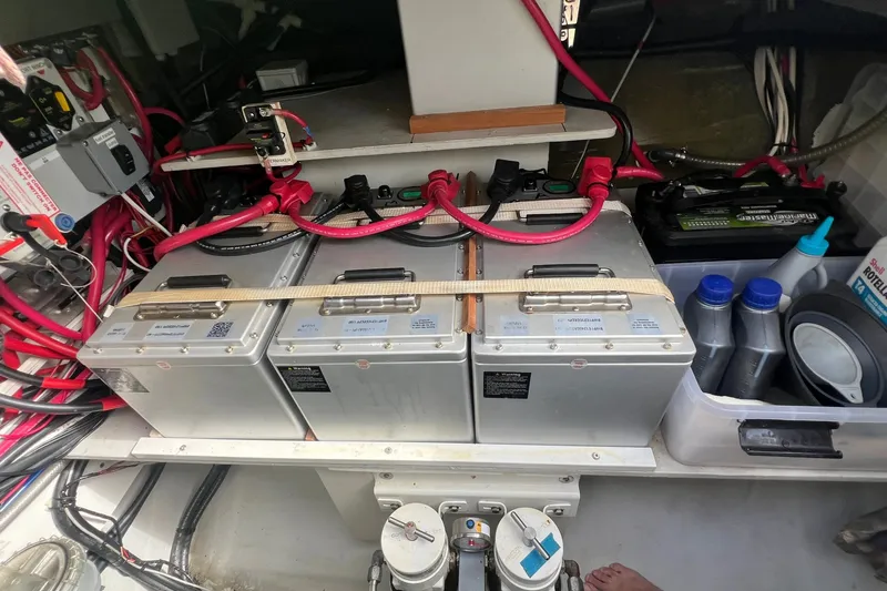 Slide: The Image of Battery compartment of a 2021 Fountaine Pajot SABA 50 catamaran, featuring organized wiring and storage. - 102