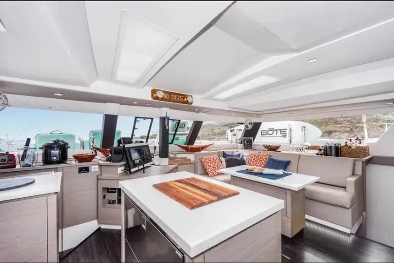 Slide: The Image of Luxurious interior of 2021 Fountaine Pajot SABA 50 catamaran with modern kitchen and seating area. - 23